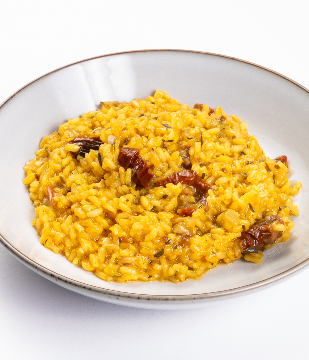 Arroz meloso de calabacín, tomate seco y romero